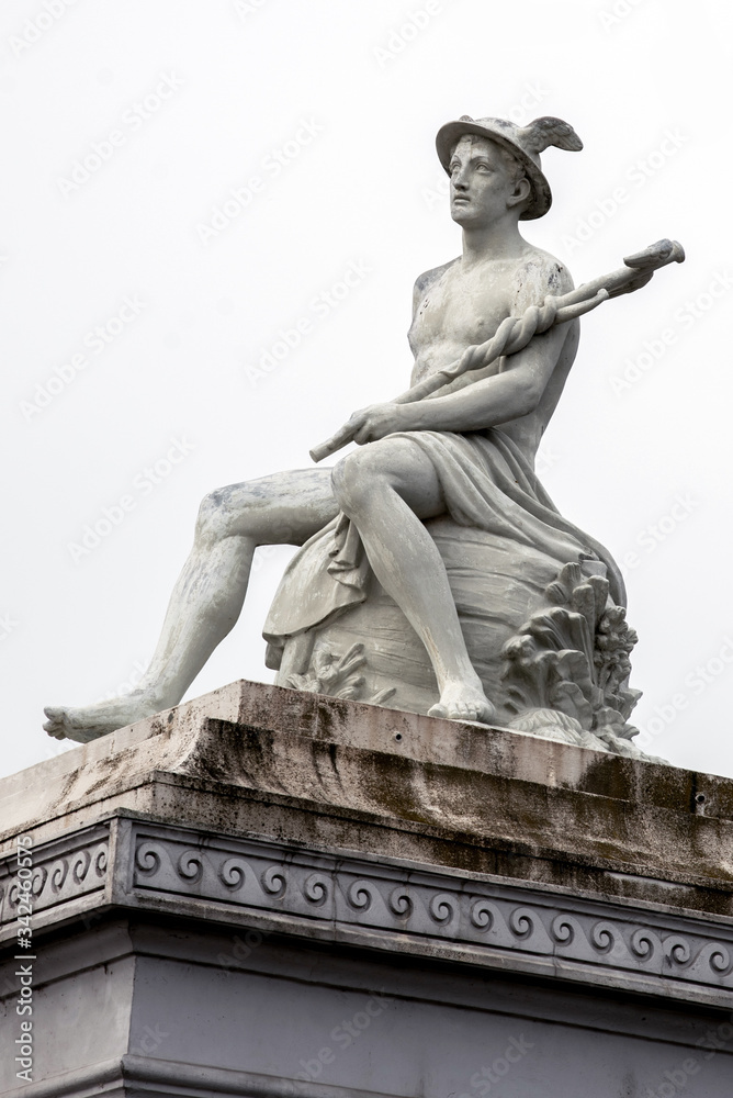 abstract background with fragment of ancient statue of god Hermes (Mercury), personification of success, prosperity, patron saint of business, traders, commerce, merchants and travelers.