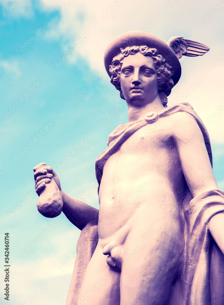 fragment of ancient statue of god Hermes (Mercury) with a purse with gold coins, personification of success, prosperity, patron saint of business, commerce and travelers. Messenger of gods.