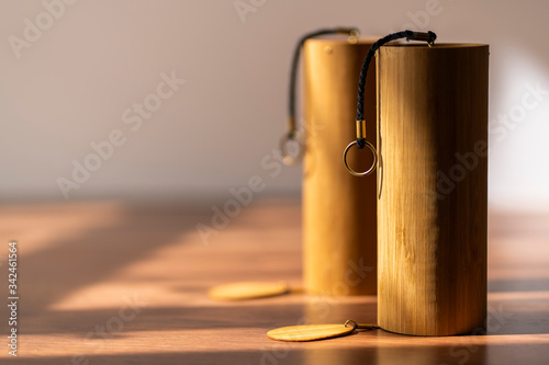 Beautiful hand made Koshi chimes musical instruments made from bamboo in a beautiful and dramatic sunlight. Koshi bells with crystalline relaxing sounds for stress release and yoga sessions.