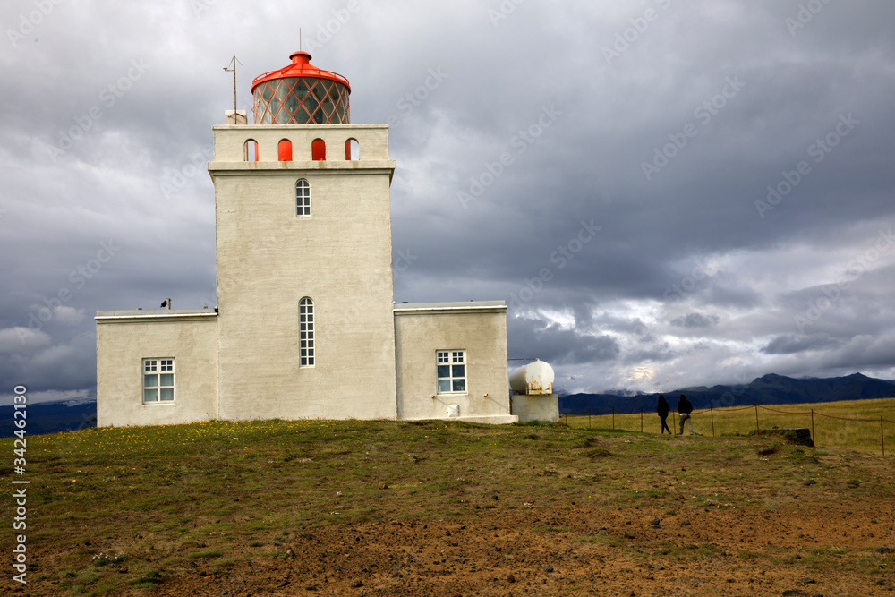 Vik / Iceland - August 15, 2017: Dyrholaey promontory lighthouse, Vik, Iceland, Europe Vik / Iceland - August 15, 2017: Dyrholaey promontory lighthouse, Vik, Iceland, Europe