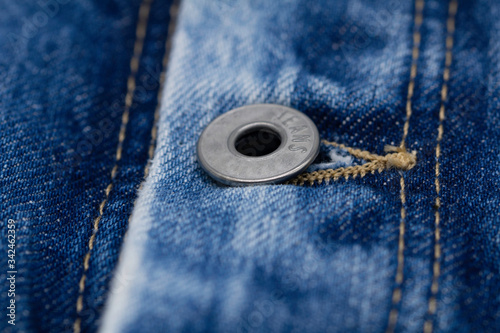 Photos Close-up shot of denim jacket, denim stitch, denim jacket button, denim jacket's