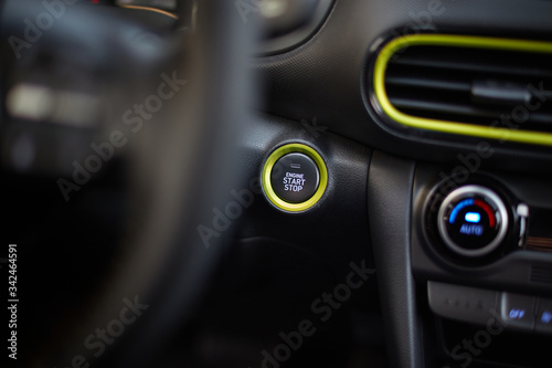 Start/stop button for starting the engine in a modern car © Artur Nyk