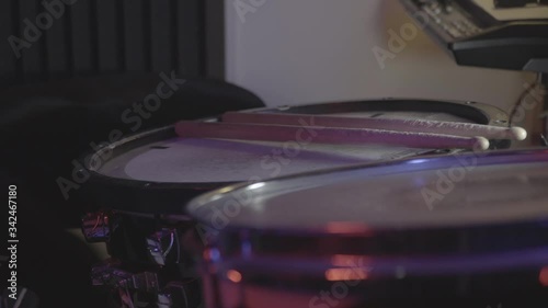 snare view with sticks and drummer hand