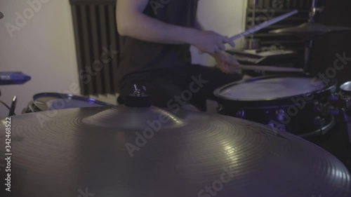 side drum view of ride cymbals while drummer playing along