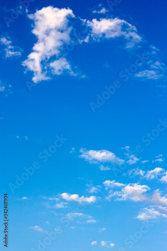 bright fluffy clouds on the blue sky. wonderful nature background in summertime