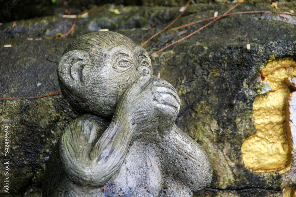 Stone monkey covering his mouth like whats up icon Stone monkey covering his mouth like whats up icon