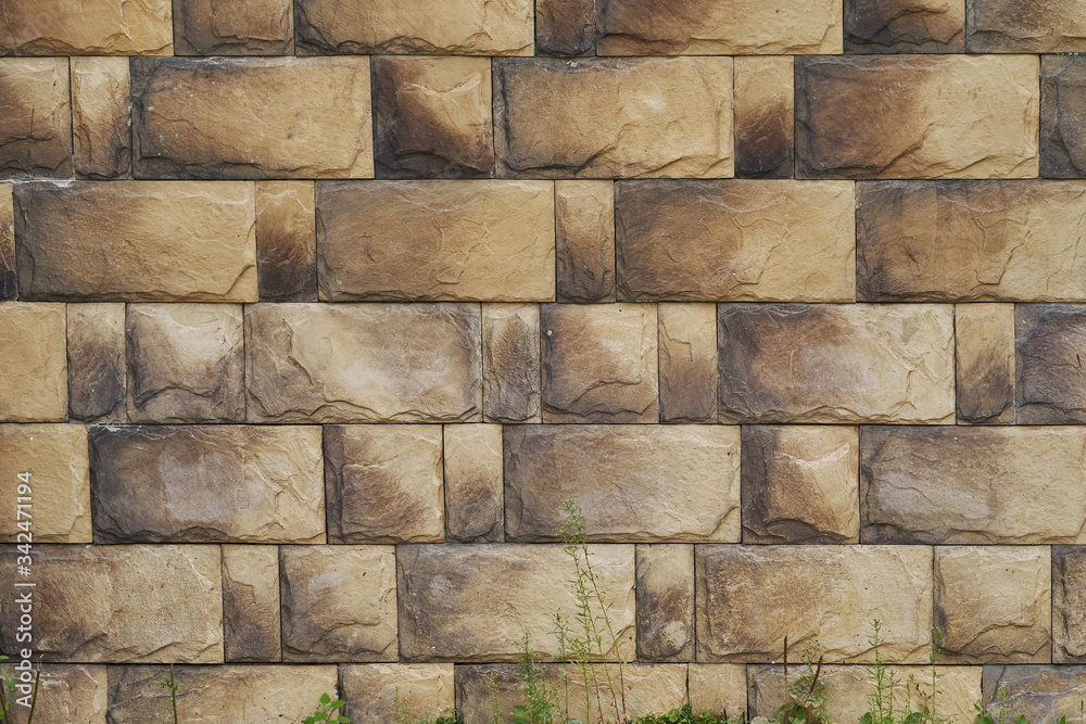 Obraz premium Background. Brown tiles with grass below