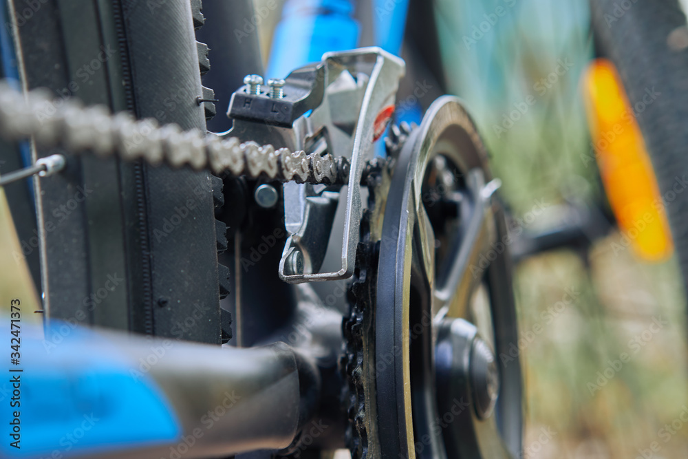 Close-up of a bicycle chain close-up with selective focus and blur Close-up of a bicycle chain close-up with selective focus and blur