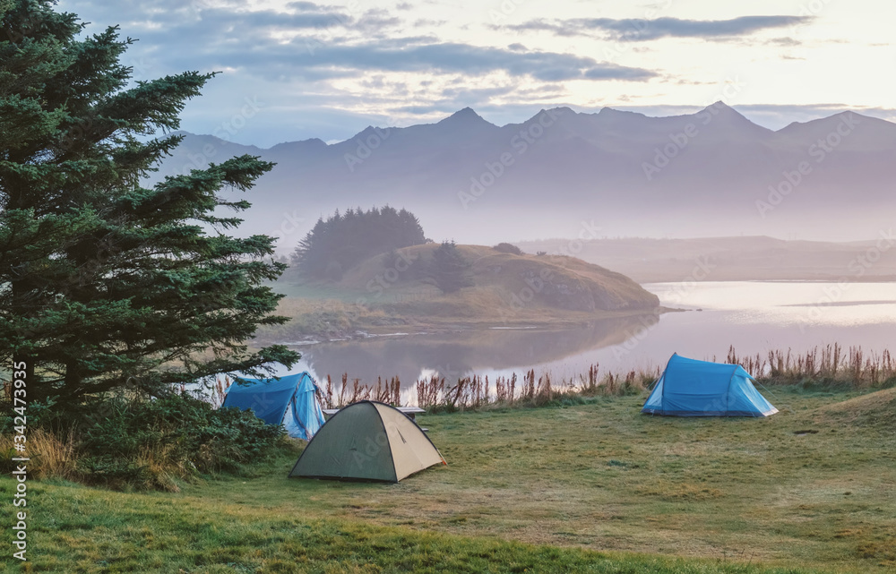 Camping on the lake in Iceland, tents at dawn, peace, tranquility and serenity