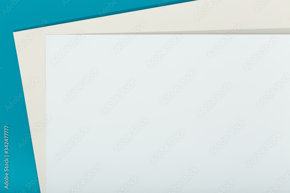 Abstract blue, beige and white color paper geometry composition background. Group of three color cardboard. Copy space Abstract blue, beige and white color paper geometry composition background. Group of three color cardboard. Copy space