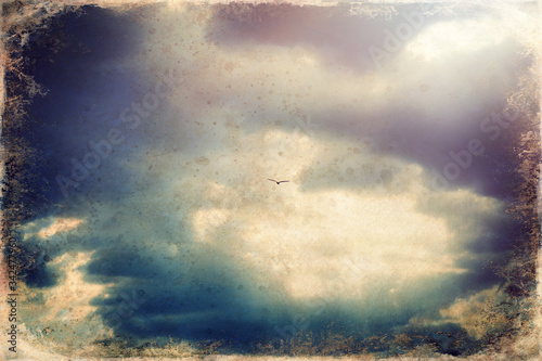 Sunset clouds and seagull, sky cloud background, old photo effect.