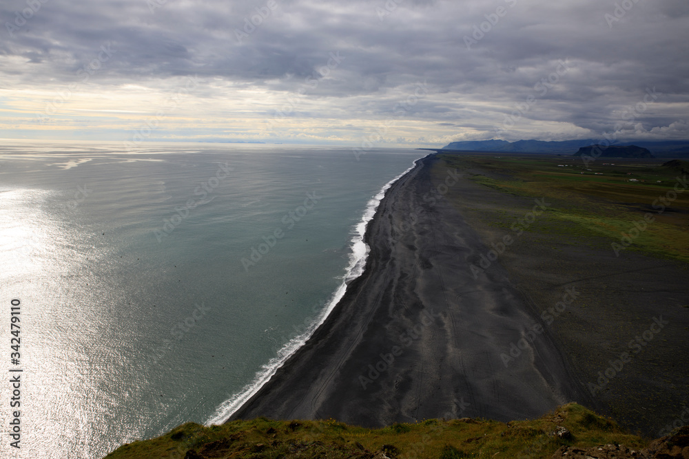 Vik / Iceland - August 15, 2017: The volcanic beach view from Dyrholaey promontory, Vik, Iceland, Europe Vik / Iceland - August 15, 2017: The volcanic beach view from Dyrholaey promontory, Vik, Iceland, Europe