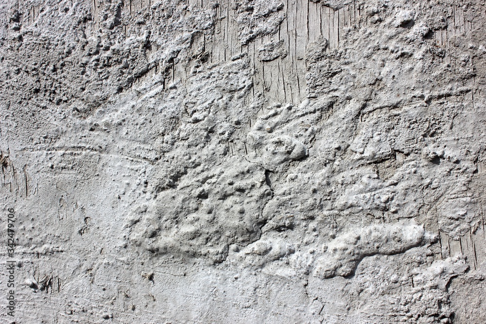 Gray wood background with a touch of cement. Vintage aged background. Gray stains. Designer vintage gray interior background wall of cement. Old texture grunge retro