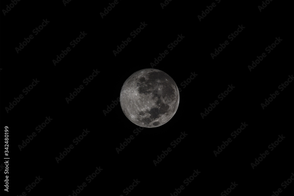 supermoon full round moon reflects light at night with a dark black background sky cloud supermoon full round moon reflects light at night with a dark black background sky cloud