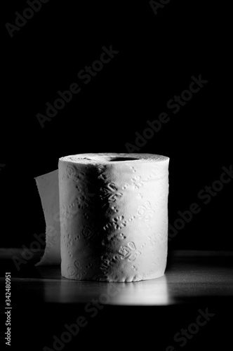 toilet paper roll on black background