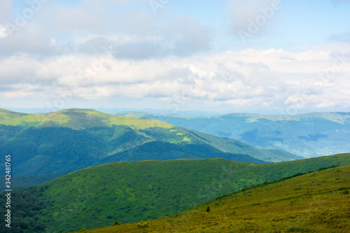 alpine scenery of carpathian mountains. stunning views on a windy summer day. clouds on the sky. ridges and valleys in the distance