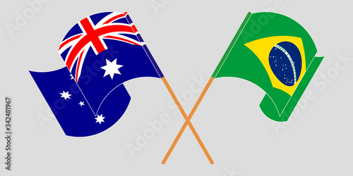 Crossed and waving flags of Australia and Brazil