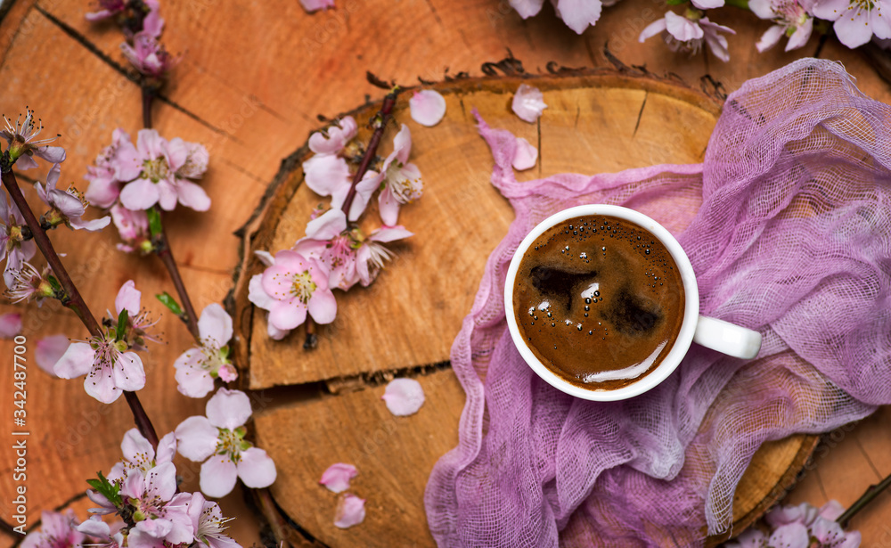 cup of coffee with flowering tree branches cup of coffee with flowering tree branches