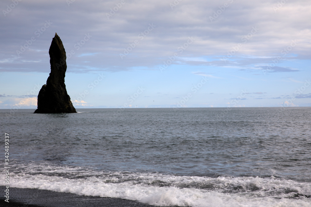 Vik / Iceland - August 15, 2017: Staks at Vik beach, Iceland, Europe Vik / Iceland - August 15, 2017: Staks at Vik beach, Iceland, Europe