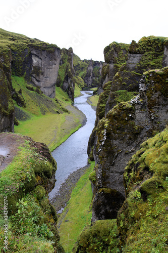 Sudhurland / Iceland - August 15, 2017: River flow through the great canyon of Fjadrargljufur.