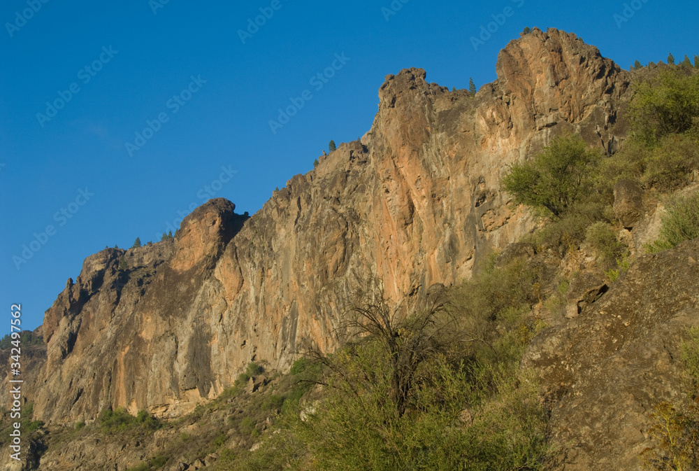 Cliff in the Roque Nublo Natural Monument. The Nublo Rural Park. Tejeda. Gran Canaria. Canary Islands. Spain. Cliff in the Roque Nublo Natural Monument. The Nublo Rural Park. Tejeda. Gran Canaria. Canary Islands. Spain.
