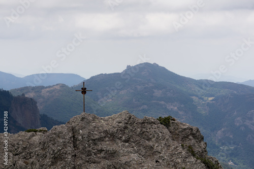 mountain top view with a cross