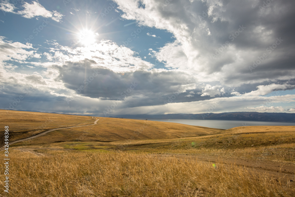 Lake Baikal. Beautiful autumn landscape of Lake Baikal with bright saturated sky, blue water.