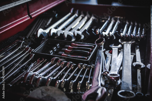 set of steel tools in a box. Wrenches, metal, for hard work. Mechanic, repair. Selective focus. Blur.