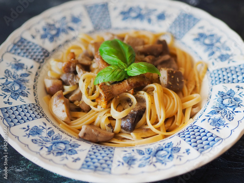 spaghetti in a cremy souce with mushrooms photo