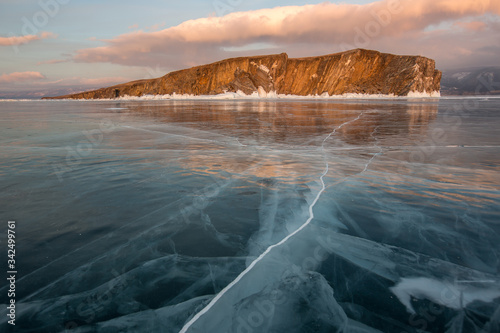 Lake Baikal. Rocky island in the ice on a sunny day
