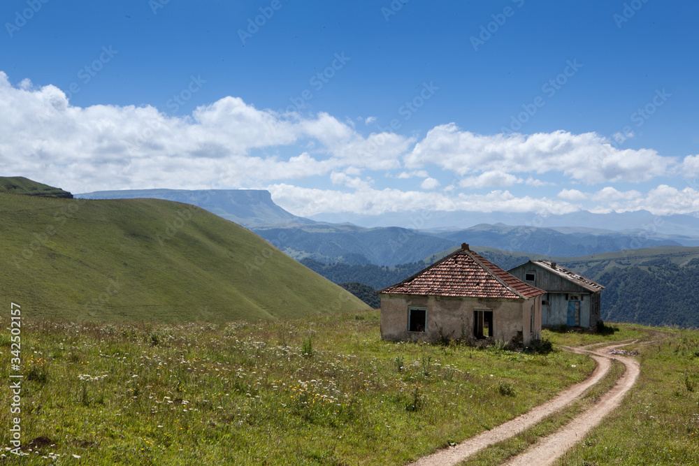 Abandoned village overlooking Mount Elbrus. Old house and amazing nature