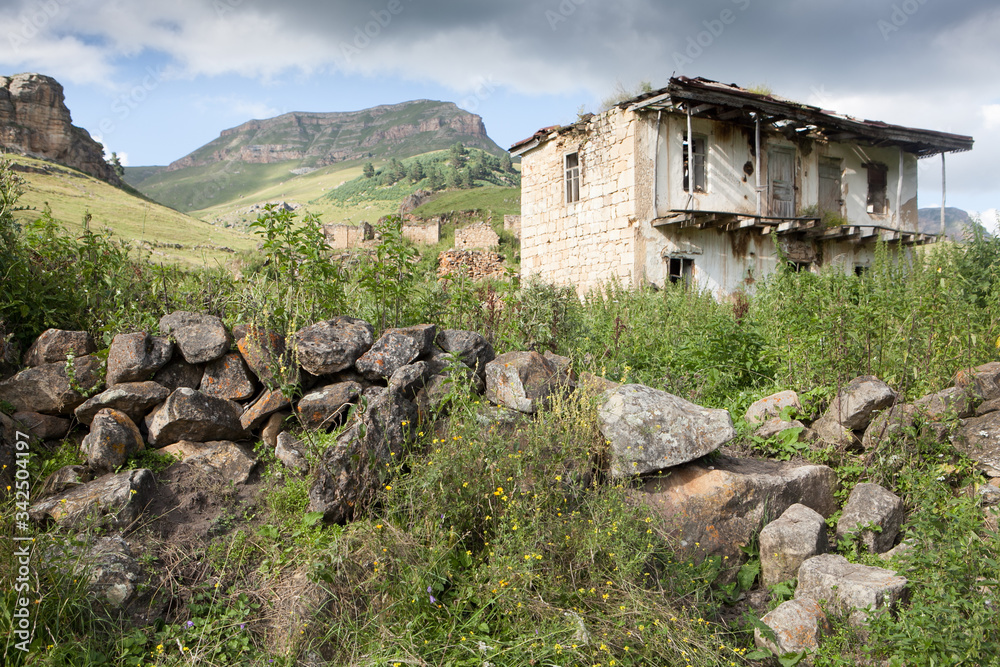 Abandoned village overlooking Mount Elbrus. Old house and amazing nature Abandoned village overlooking Mount Elbrus. Old house and amazing nature