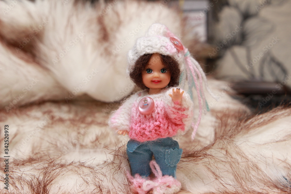 A small beautiful child's doll, posing in beautiful places. A small beautiful child's doll, posing in beautiful places.