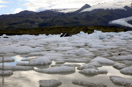 Fjallsarlon / Iceland - August 18, 2017: Fjallsarlon Glacier Lagoon view with ice formations, Iceland, Europe