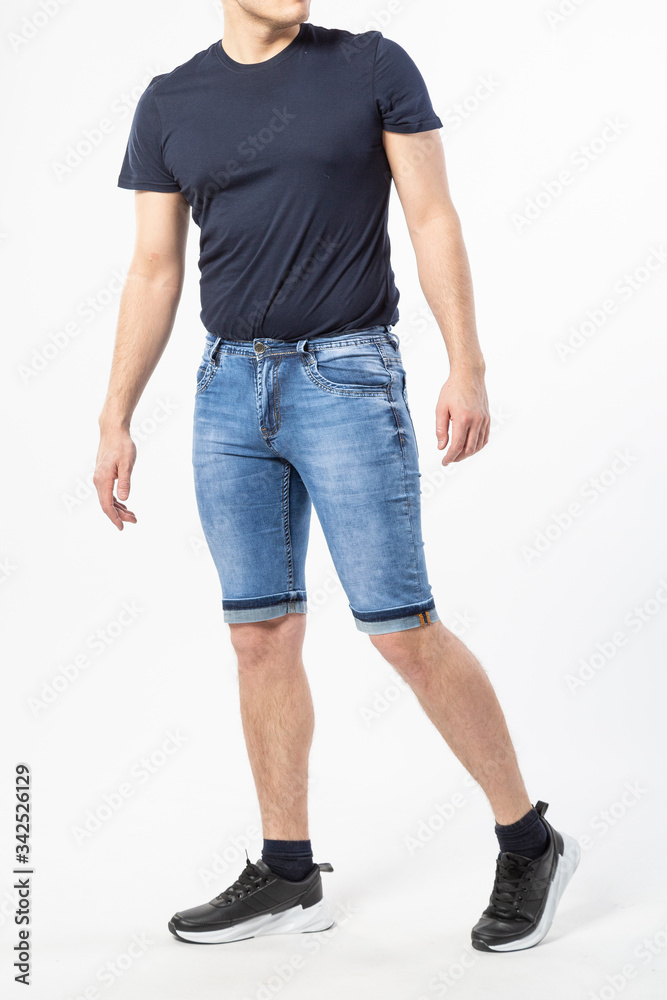 Obraz premium a man in denim shorts on a white background