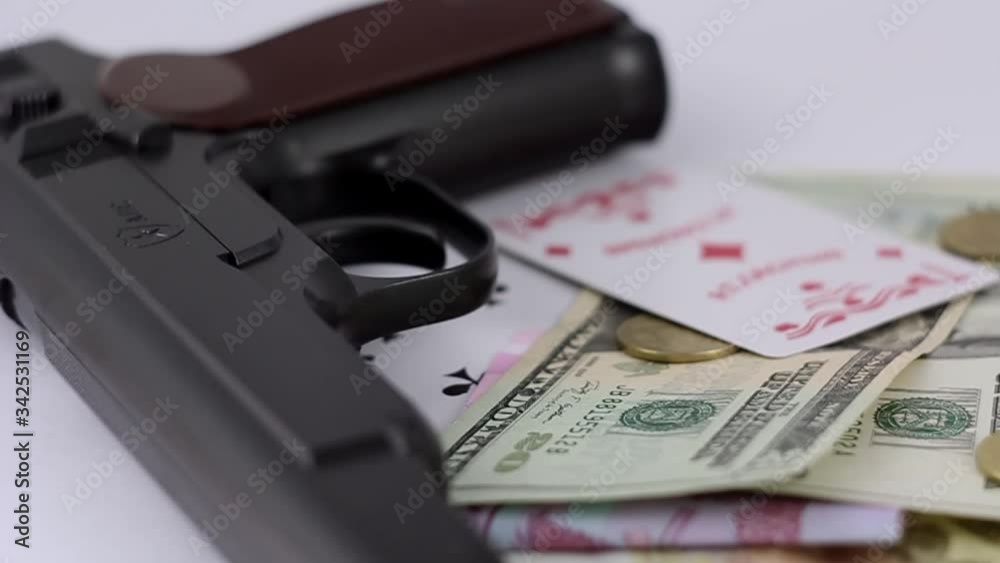 Black gun, money and cards. Black gun, money and cards.