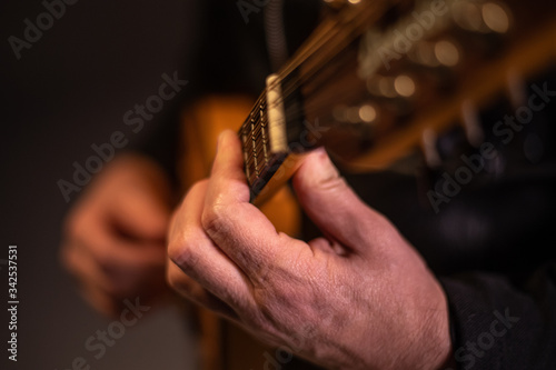 close up performer plays classical mandolin