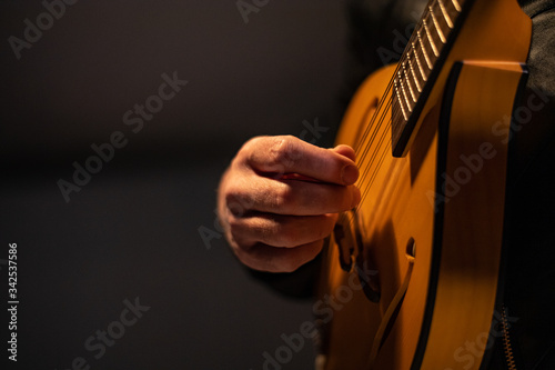 close up performer plays classical mandolin photo