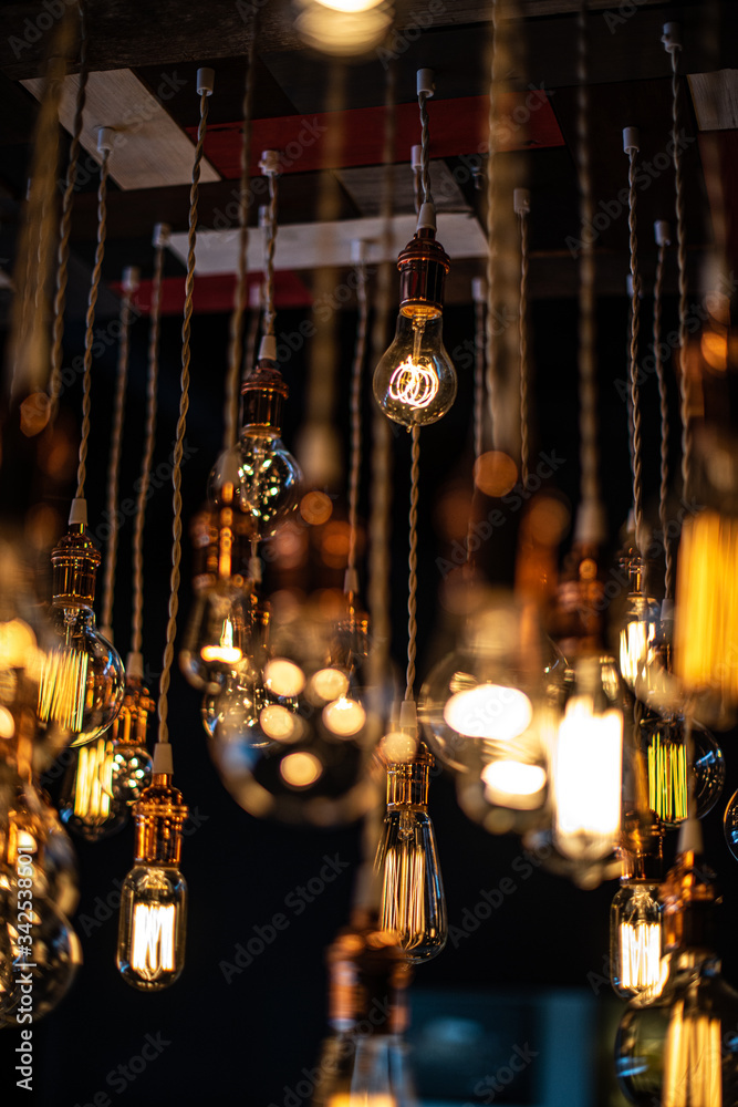 Hanging array of many incandescent light bulbs