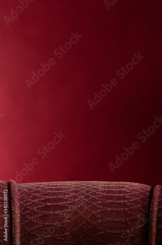  red arm chair back on red background