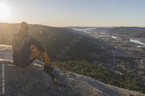 A man looking at Drammen city.