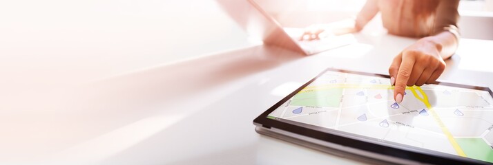 Person Using GPS Service On Digital Laptop