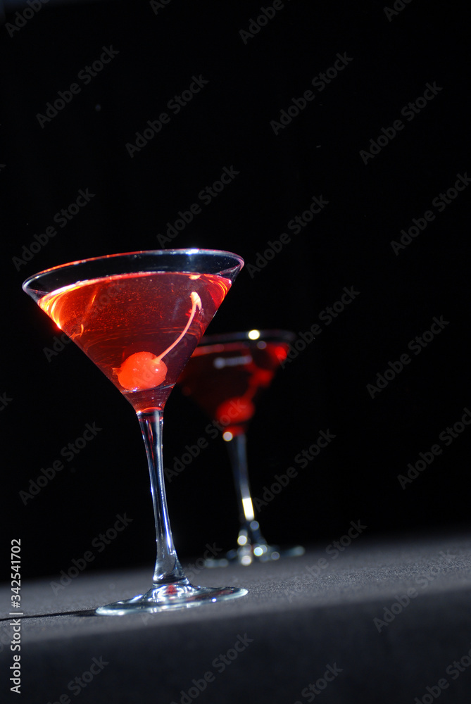 Red cocktail in martini glass