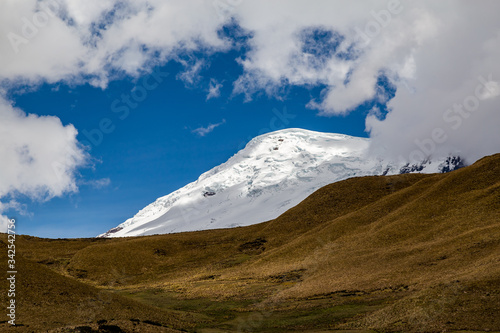 Antisana volcano, mountain with snow and glaciers in the middle of an Andean landscape