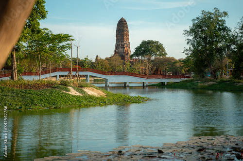 Ancient Aytthaya temple in the background of beautiful park with a lake