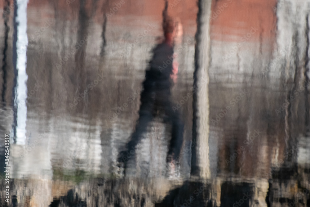 reflection of a man running