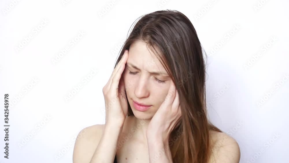One handsome woman suffers from a headache One handsome woman suffers from a headache