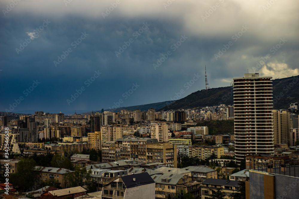 Naklejka premium Dramatic sky over Tbilisi city centre