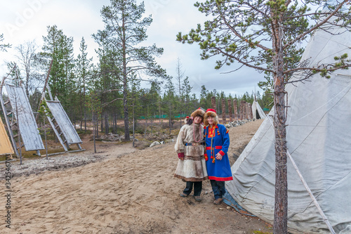 two female saami, sami in national dress, saami village on the Kola Peninsula, Russia. photo