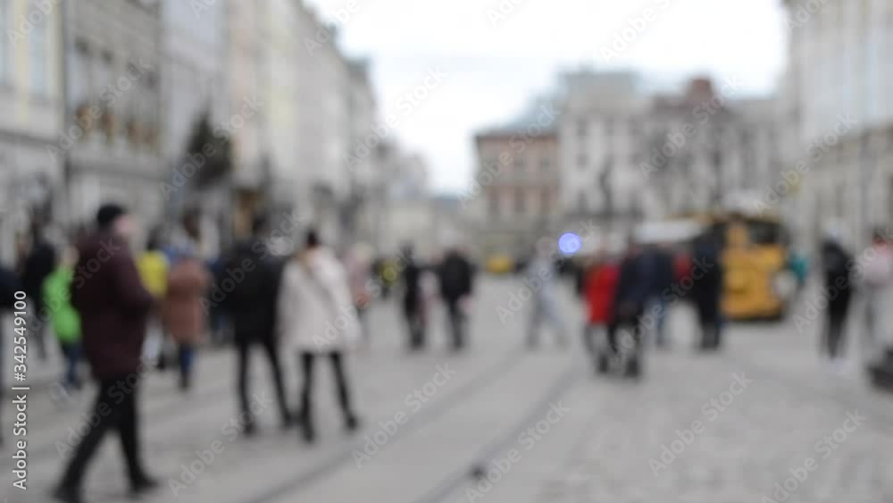Abstract Defocused Blurred Background of many people on street square Abstract Defocused Blurred Background of many people on street square